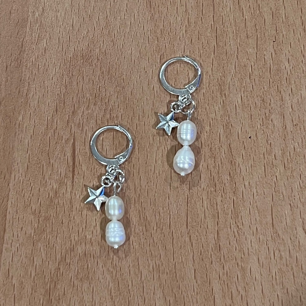Dangling pearl drop and star earrings